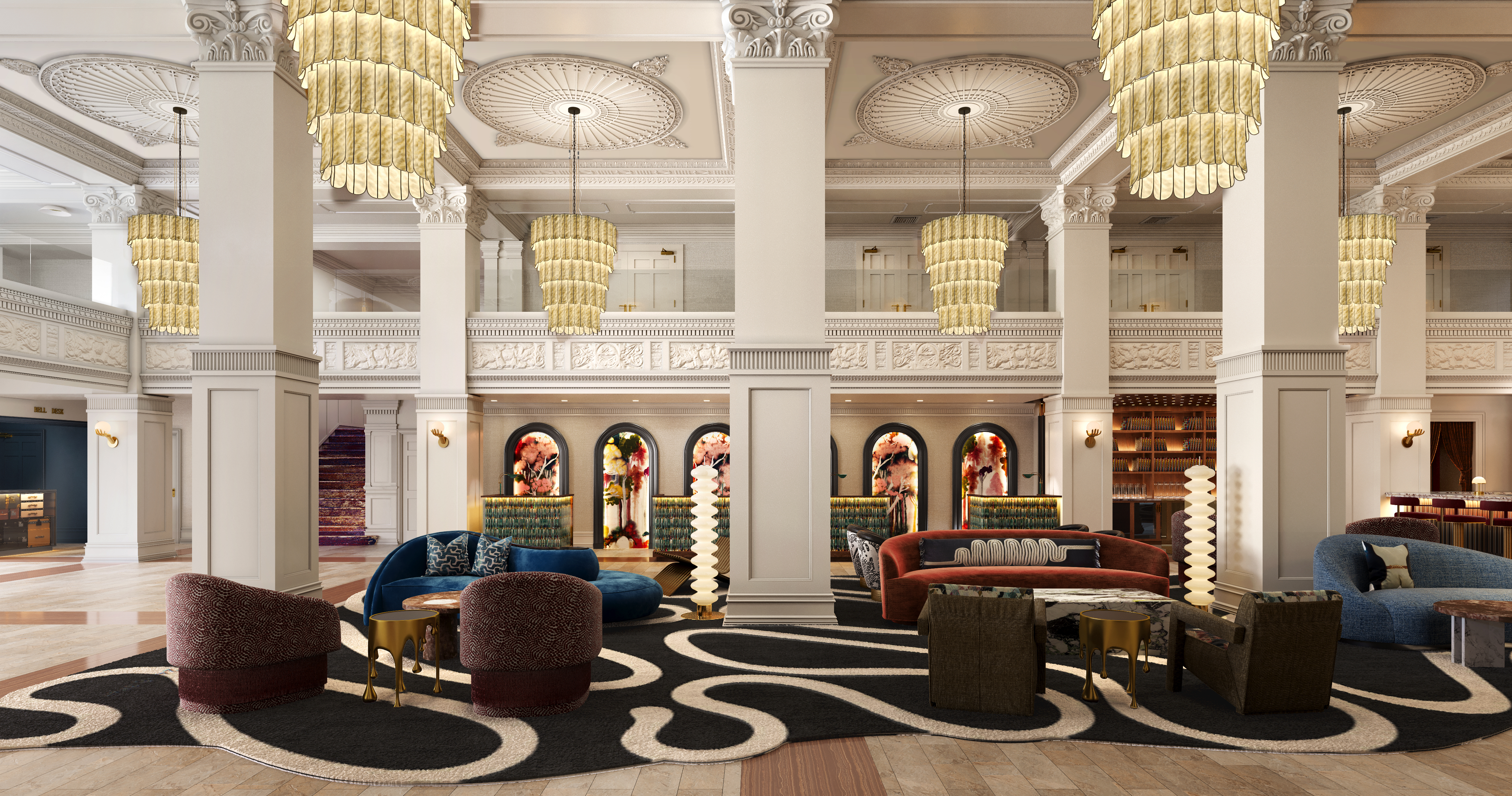 a large lobby with a large chandelier and couches